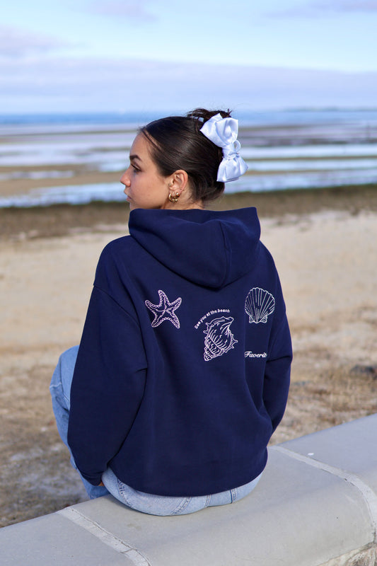 Model wearing embroidered FAVERIT hoodie in Melbourne